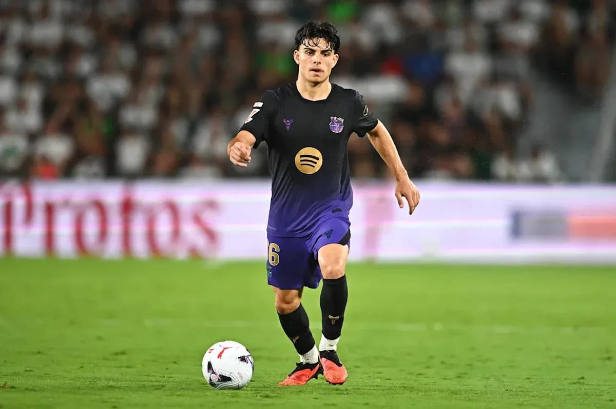 Player dribbling the ball during a soccer match Player dribbling the ball during a soccer match