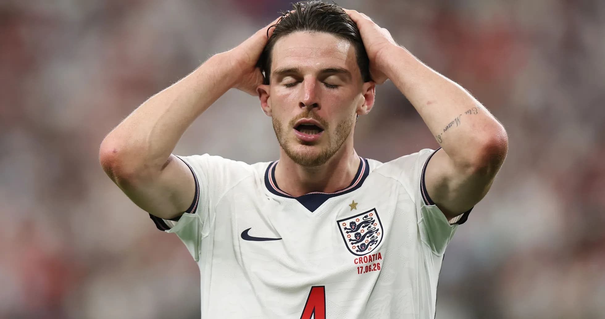 Player in England jersey with hands on head Player in England jersey with hands on head