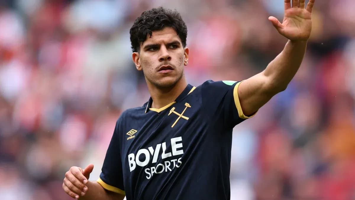 Player waving during a football match Player waving during a football match