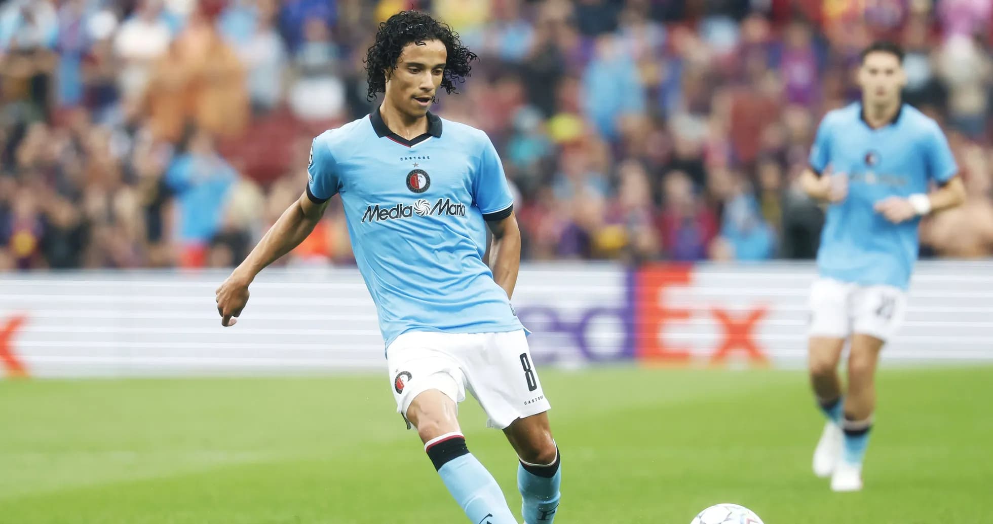 Player dribbling the ball during a match Player dribbling the ball during a match