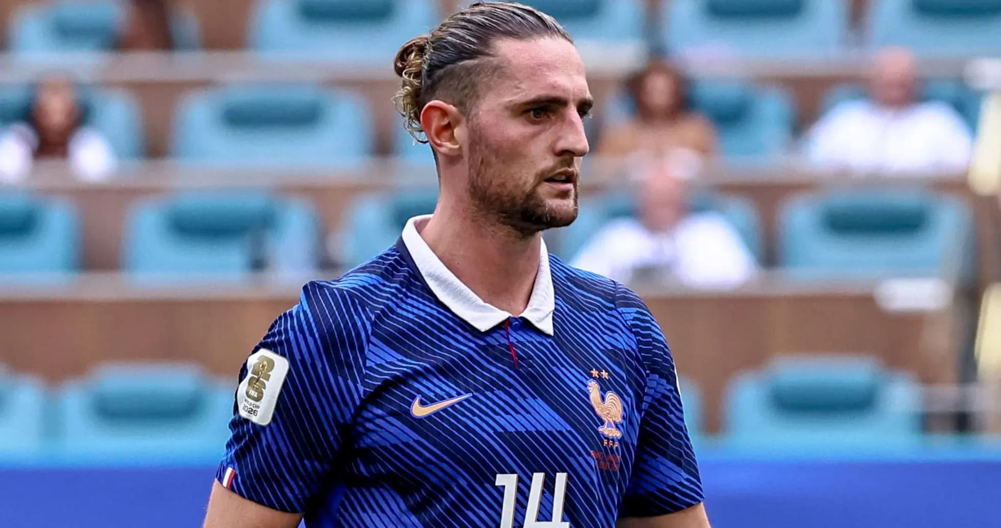 Player in France national team jersey on field Player in France national team jersey on field