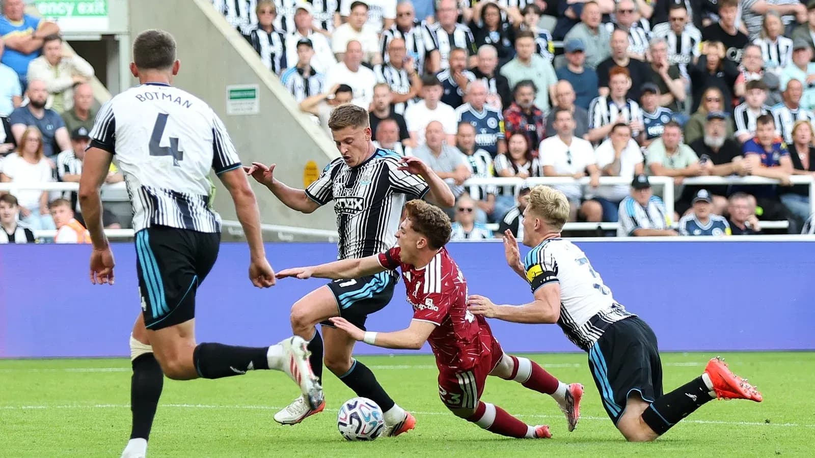 Players contesting for the ball during a match Players contesting for the ball during a match