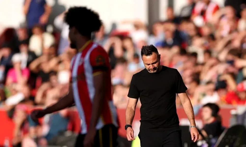 Manager walking past player during match Manager walking past player during match