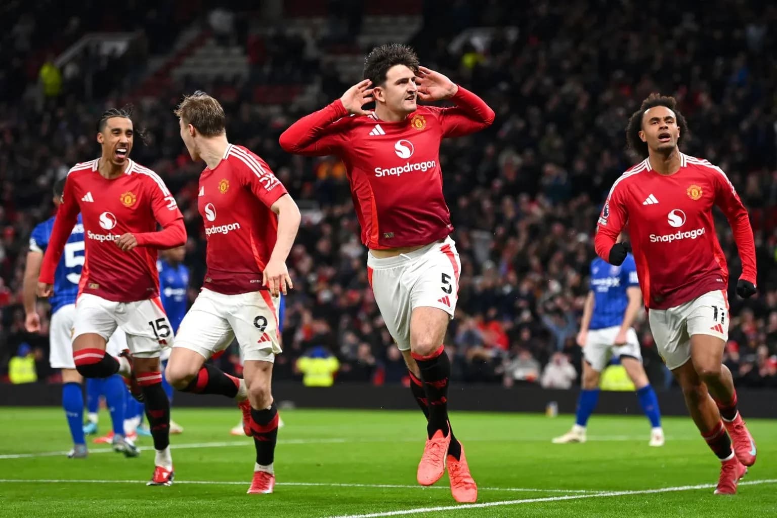 Manchester United players celebrating a goal Manchester United players celebrating a goal