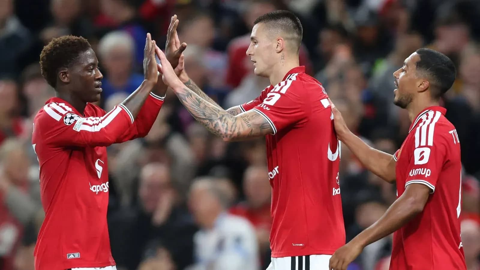 Players celebrating a goal during a match Players celebrating a goal during a match
