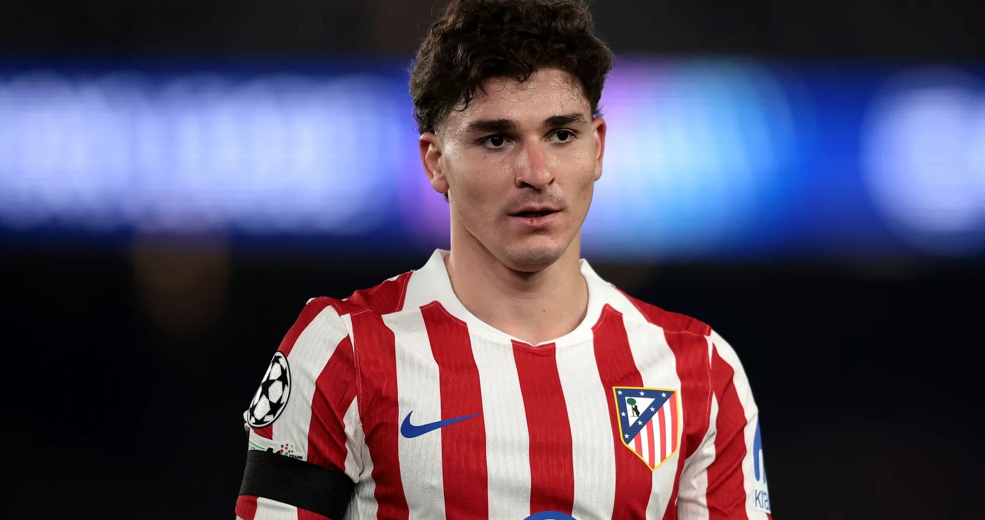 Atletico Madrid player wearing team jersey on field Atletico Madrid player wearing team jersey on field