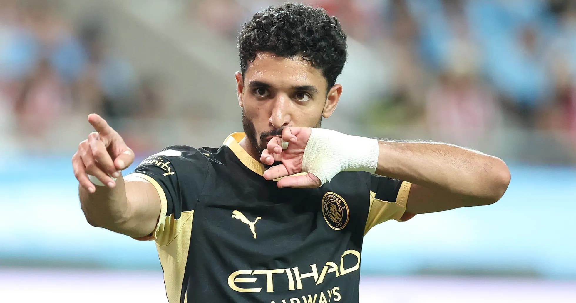 Player celebrating goal with gesture during match Player celebrating goal with gesture during match