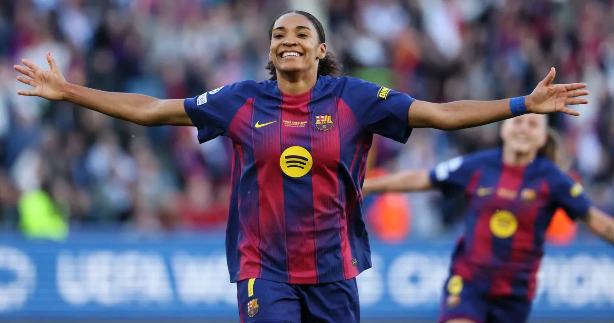 Barcelona player celebrating a goal with arms outstretched Barcelona player celebrating a goal with arms outstretched