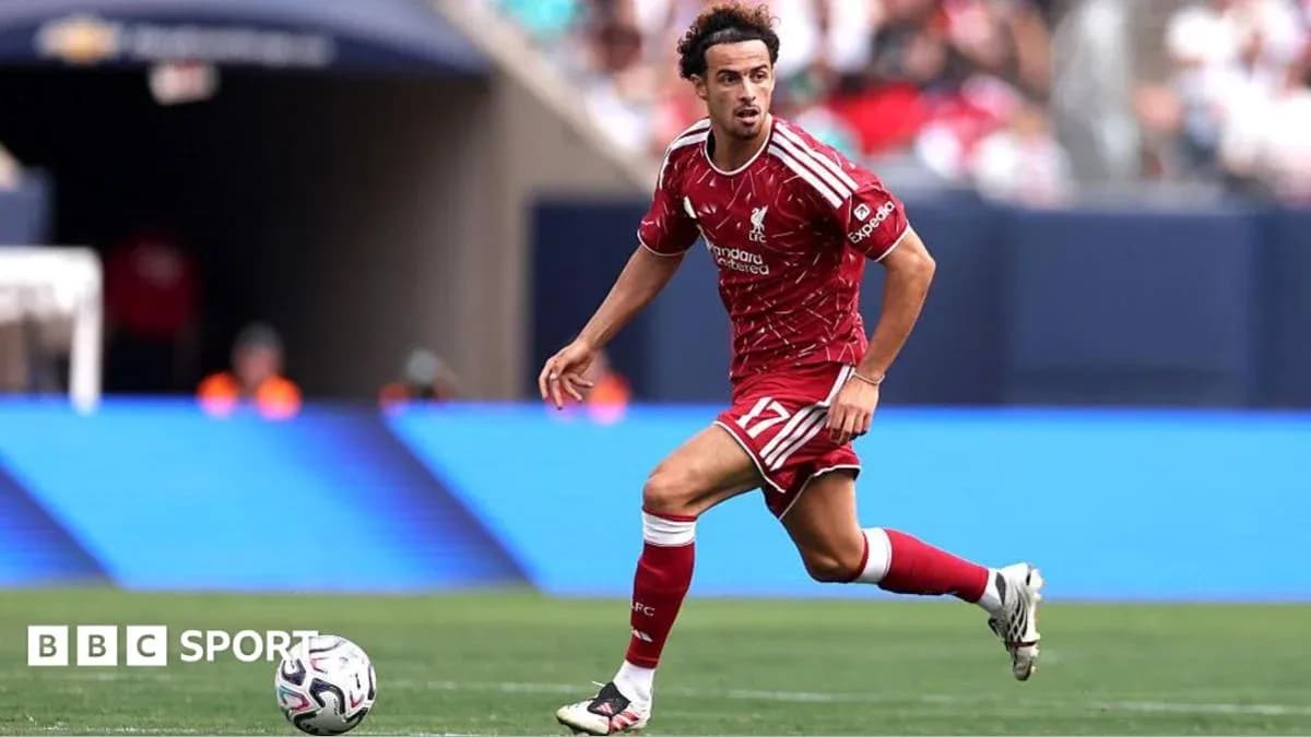 Player in Liverpool kit dribbling the ball during match Player in Liverpool kit dribbling the ball during match
