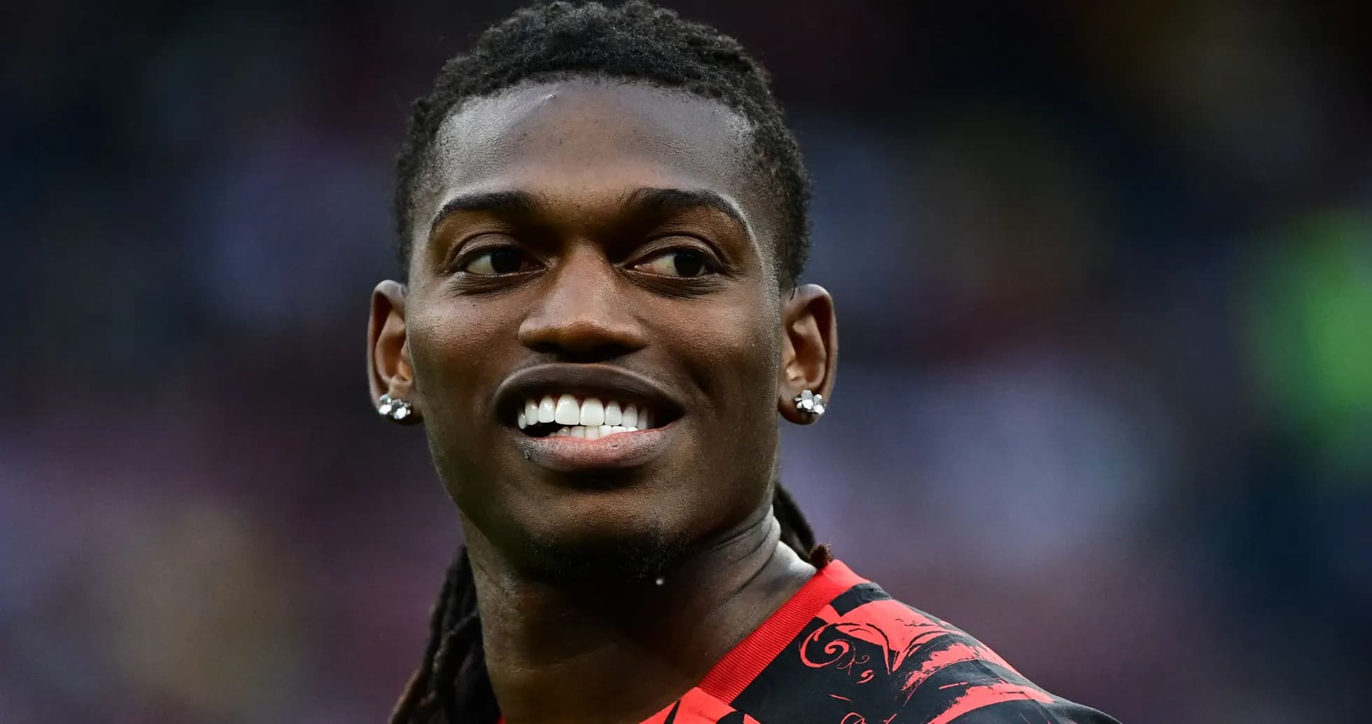 Player smiling during a football match Player smiling during a football match