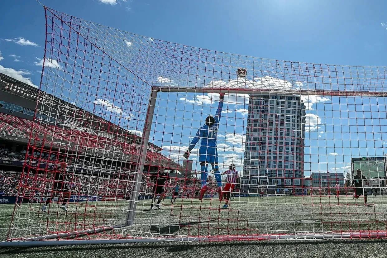 Goalkeeper jumping to save the ball Goalkeeper jumping to save the ball