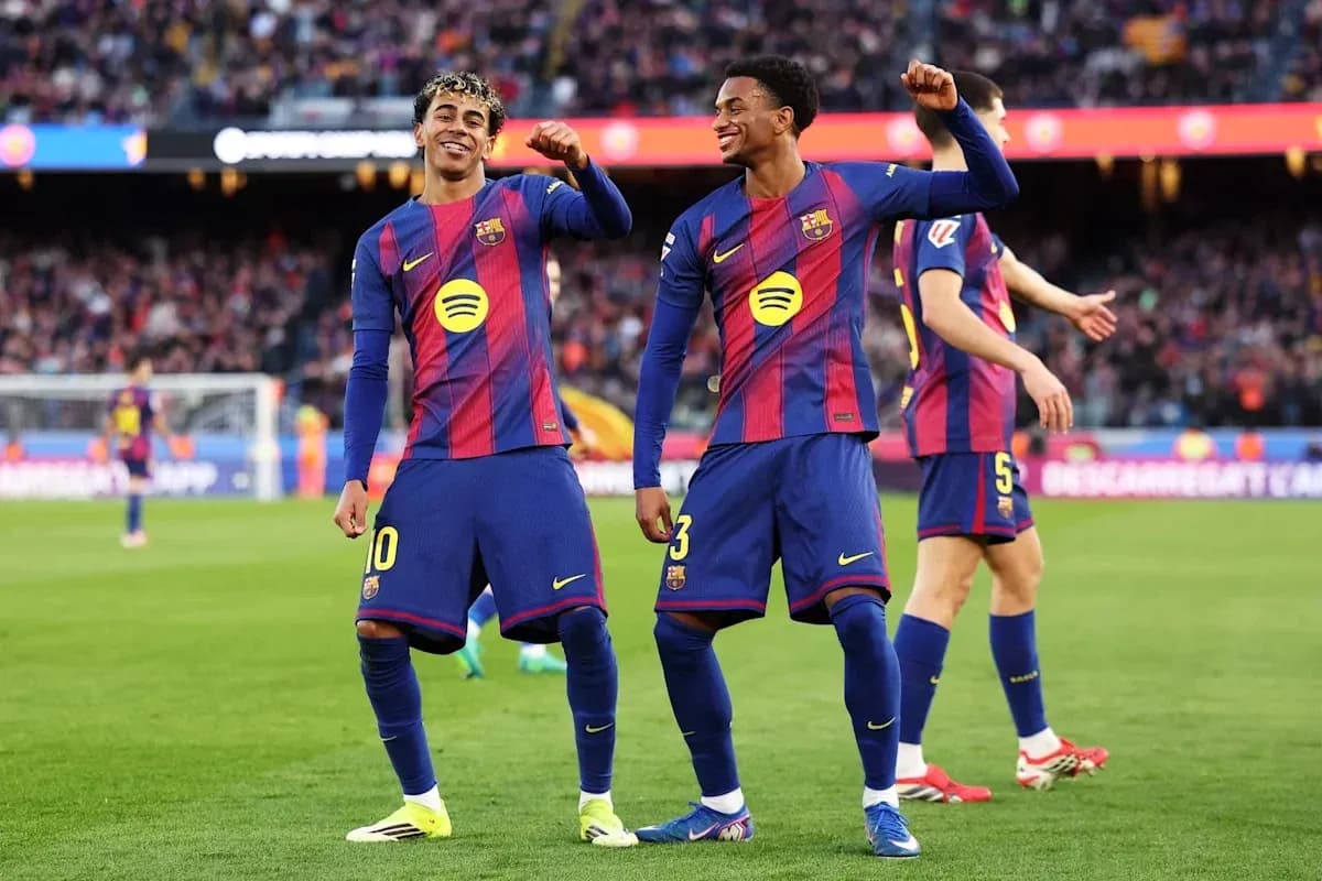 Barcelona players celebrating a goal on the pitch Barcelona players celebrating a goal on the pitch