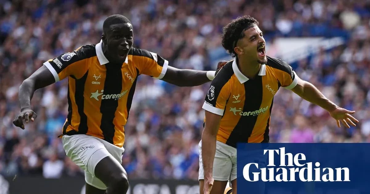 Two players celebrating a goal on the field Two players celebrating a goal on the field