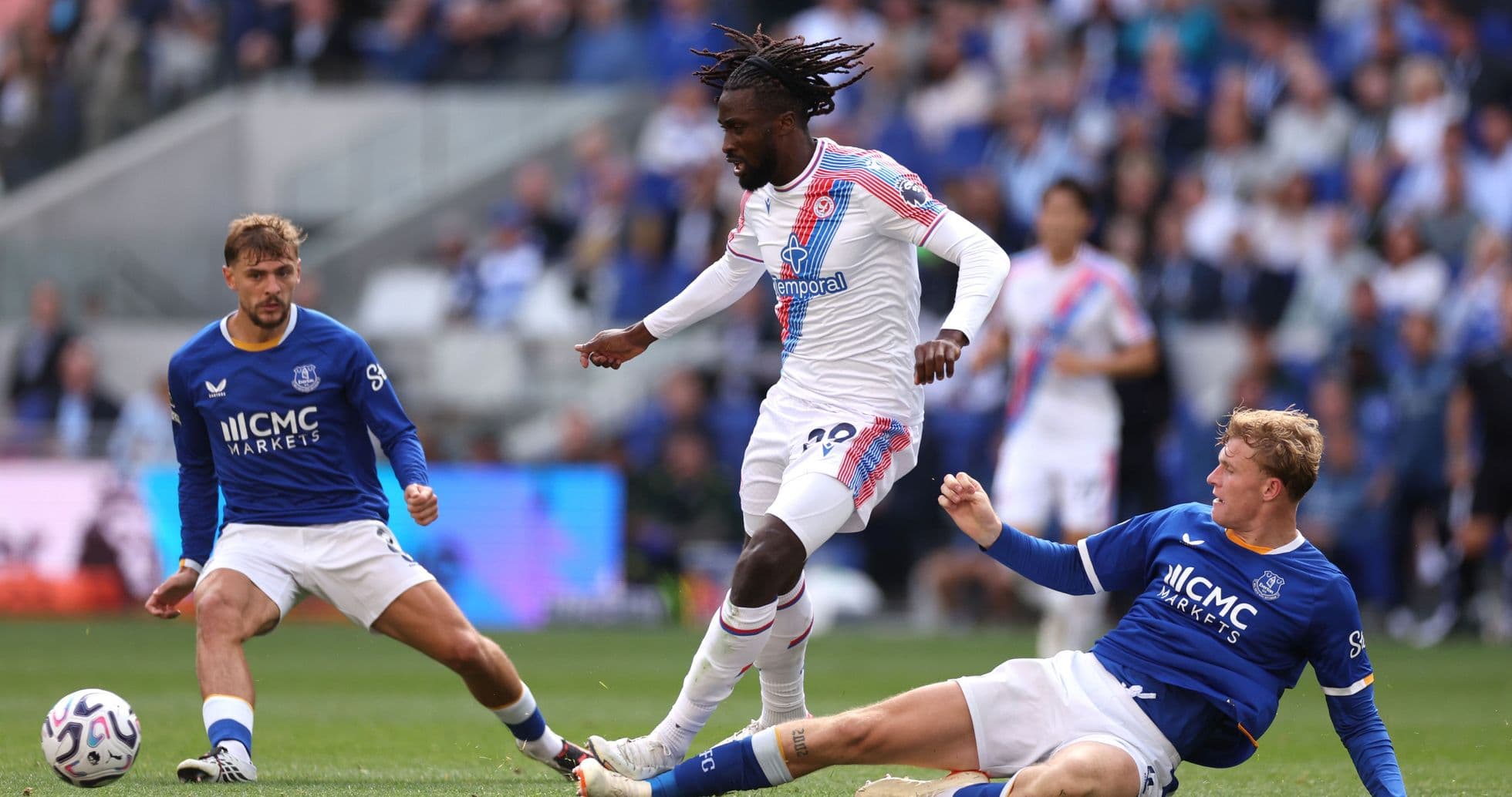 Player dribbling past opponents during a match Player dribbling past opponents during a match