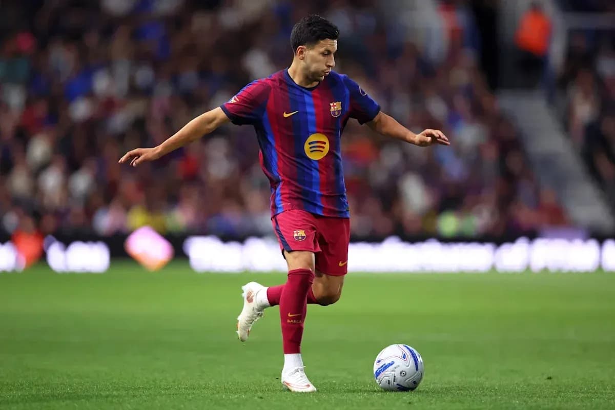 Player in Barcelona kit preparing to kick ball Player in Barcelona kit preparing to kick ball