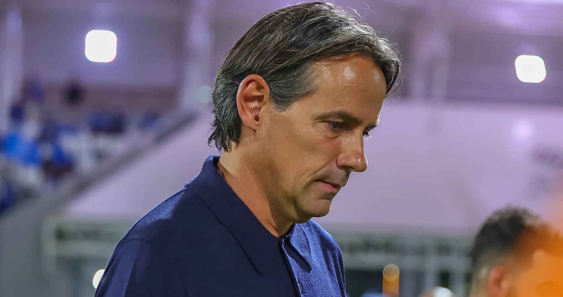Coach walking on the sidelines during a match Coach walking on the sidelines during a match