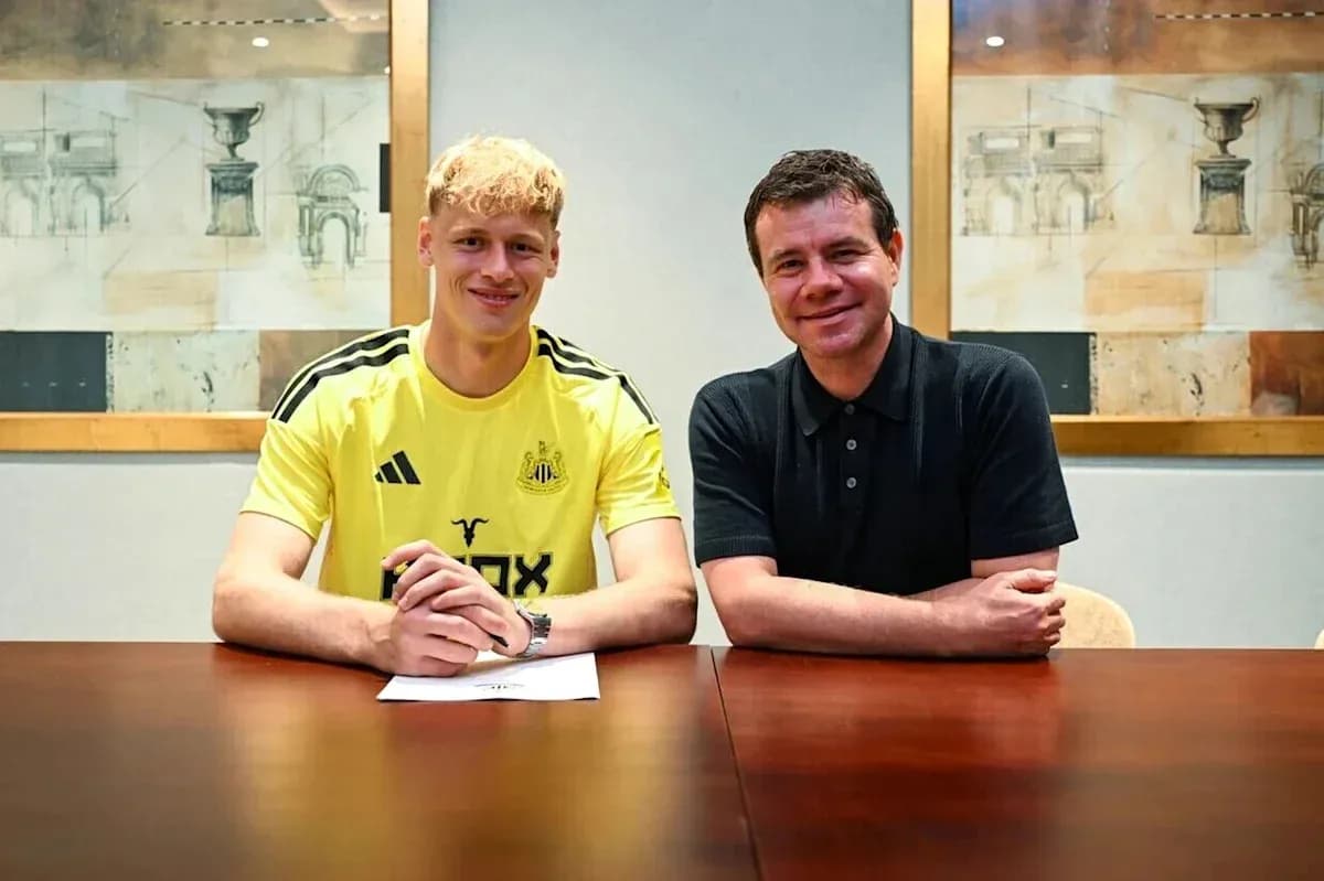 Newcastle player signing contract with club representative Newcastle player signing contract with club representative