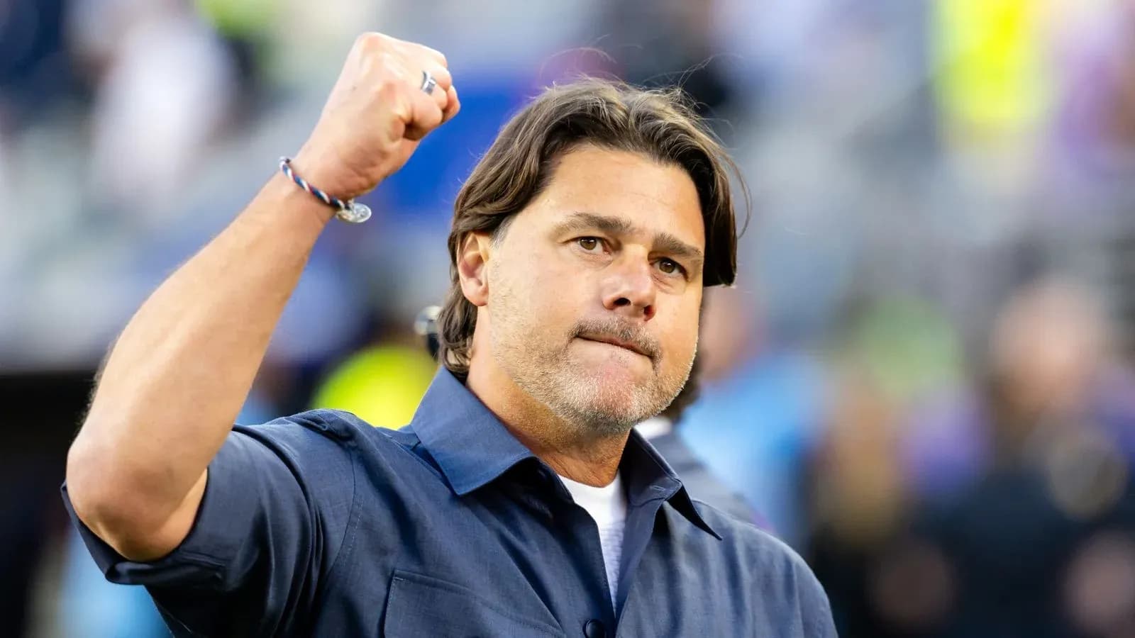 Coach celebrating with raised fist during match Coach celebrating with raised fist during match