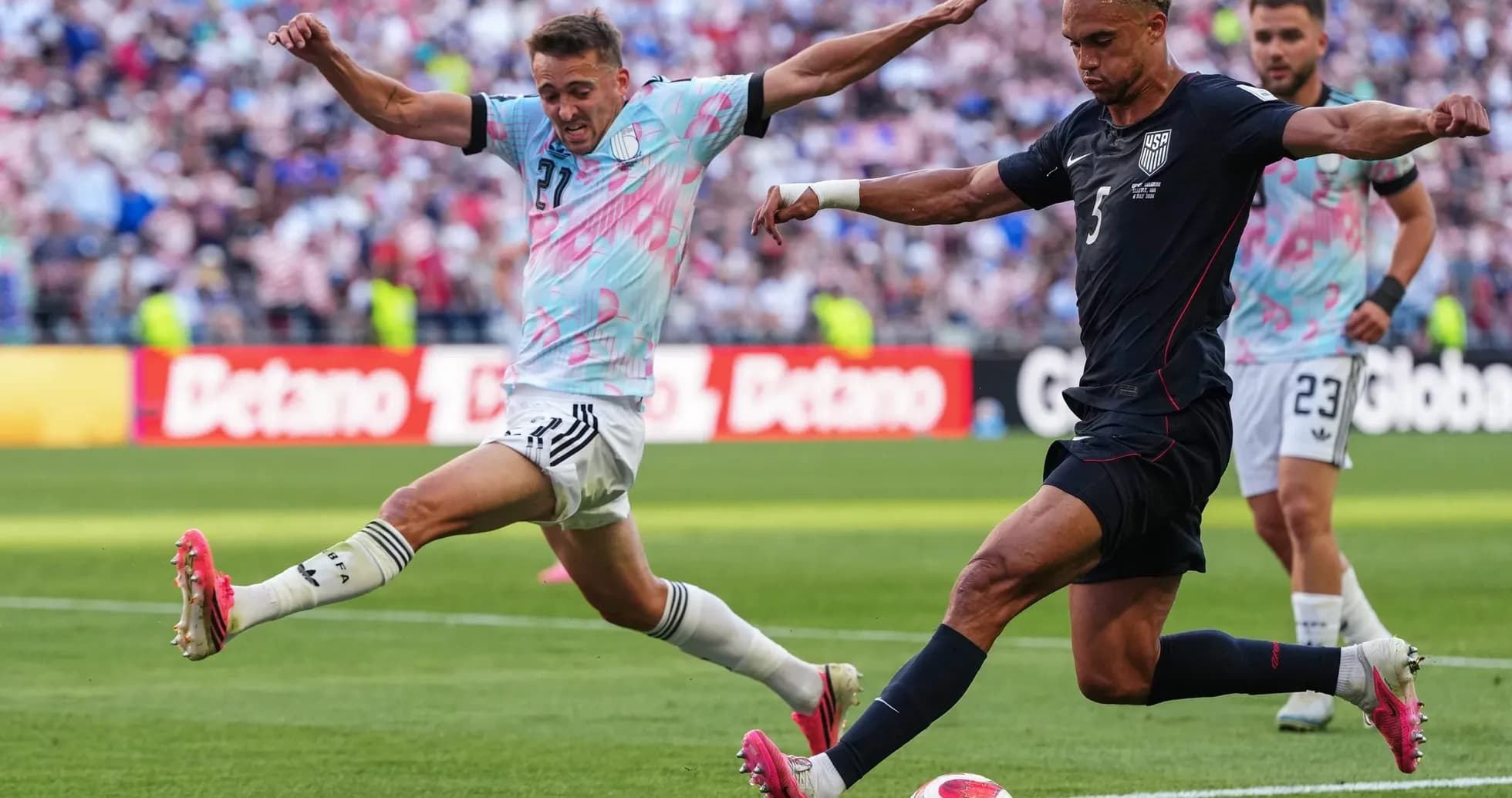 USA player kicking ball against Belgium USA player kicking ball against Belgium