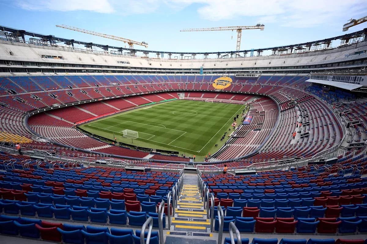 View of stadium with empty seats and field View of stadium with empty seats and field