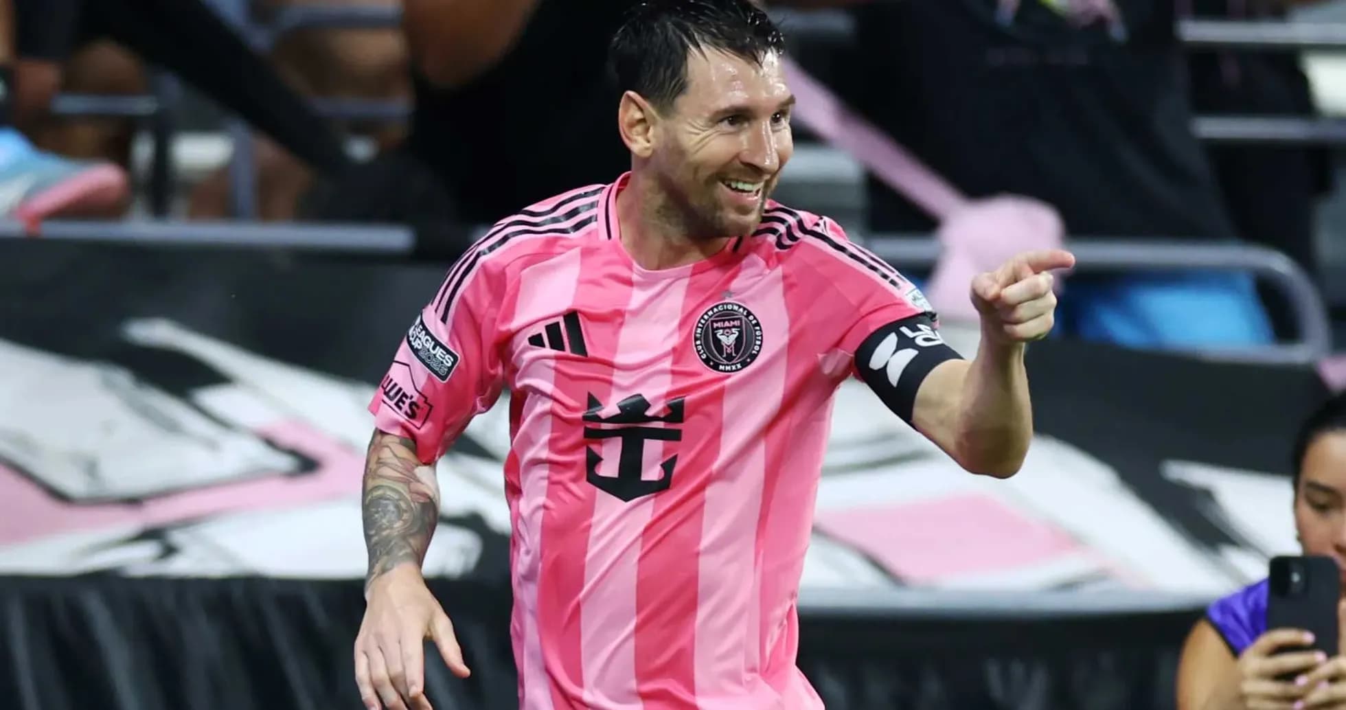 Player celebrating in pink jersey during match Player celebrating in pink jersey during match
