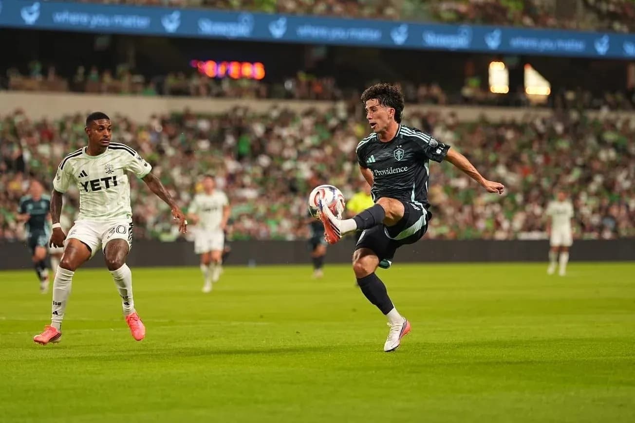 Seattle Sounders player kicking the ball Seattle Sounders player kicking the ball