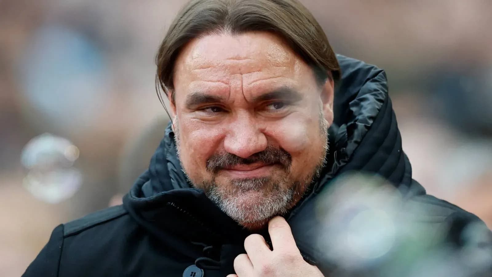 Coach smiling while wearing a black jacket Coach smiling while wearing a black jacket