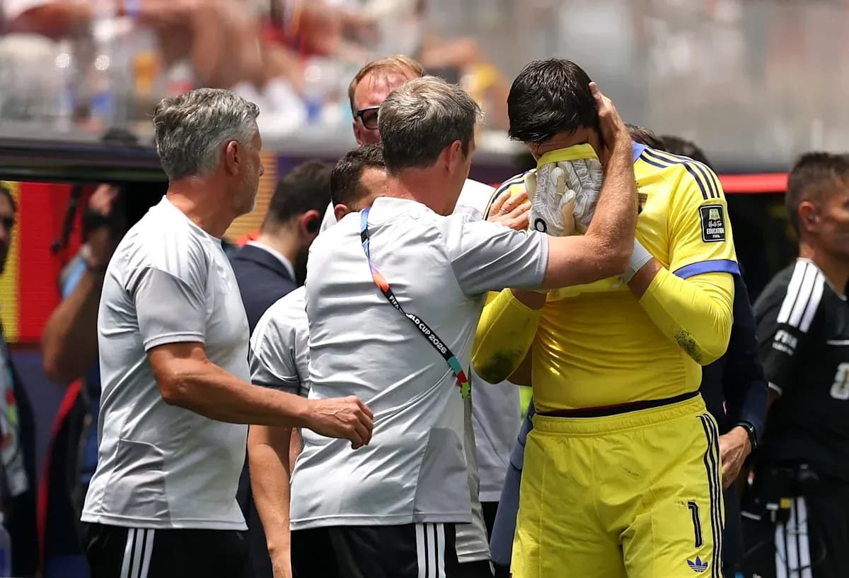 Coach comforting goalkeeper after match on sidelines Coach comforting goalkeeper after match on sidelines