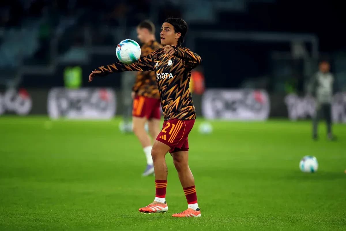 Player warming up and juggling the ball during training Player warming up and juggling the ball during training