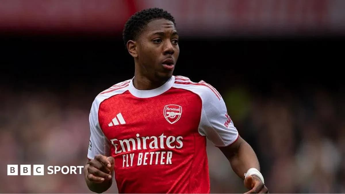 Arsenal player running on the pitch during match Arsenal player running on the pitch during match