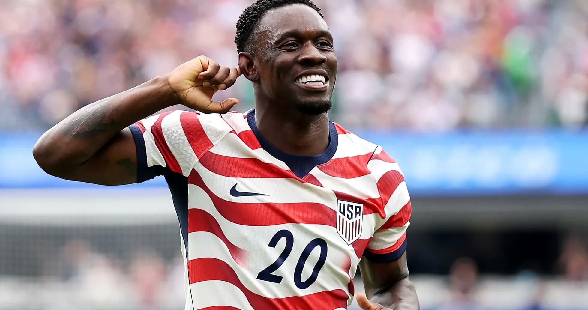 Player celebrating goal in USA jersey during match Player celebrating goal in USA jersey during match