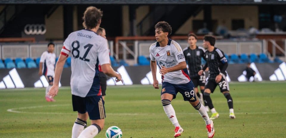 Players from The Town and Real Monarchs in action Players from The Town and Real Monarchs in action
