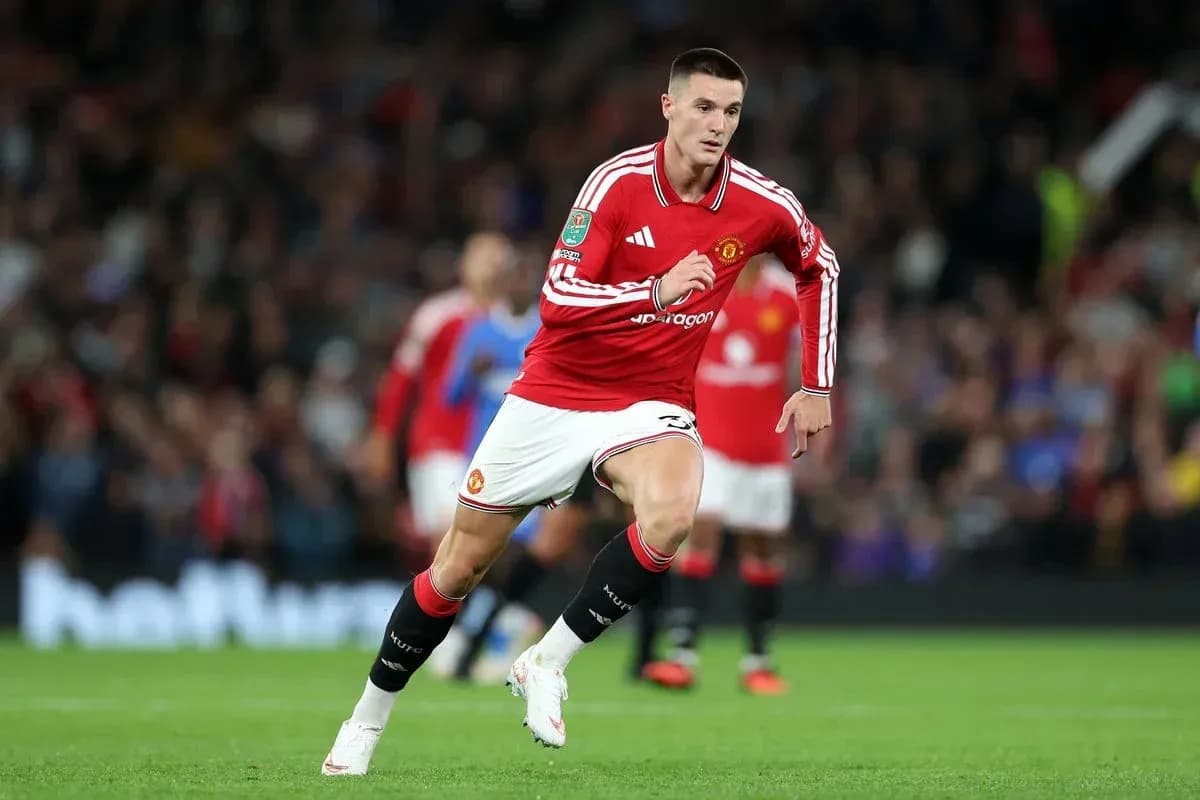 Player running on the field in Manchester United kit Player running on the field in Manchester United kit