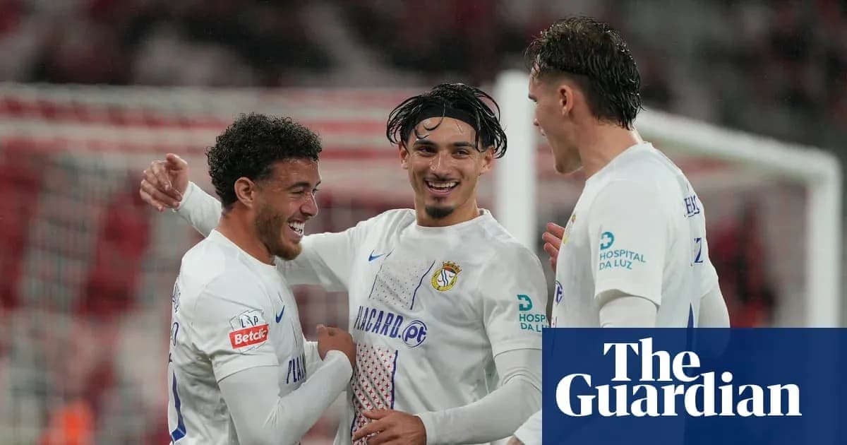 Three football players celebrating a goal together Three football players celebrating a goal together
