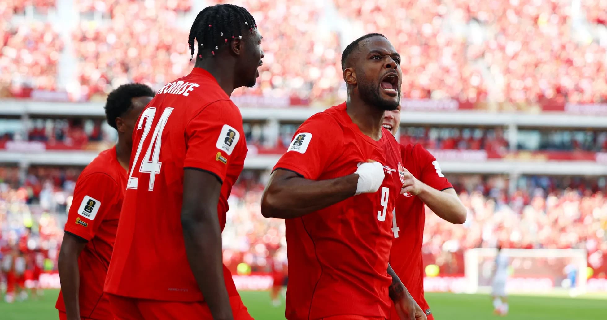 Canada players celebrating a goal in World Cup match Canada players celebrating a goal in World Cup match