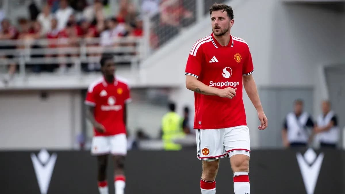 Manchester United player walking on the field Manchester United player walking on the field