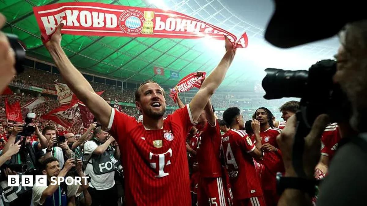 Player celebrating with Bayern Munich fans in stadium Player celebrating with Bayern Munich fans in stadium