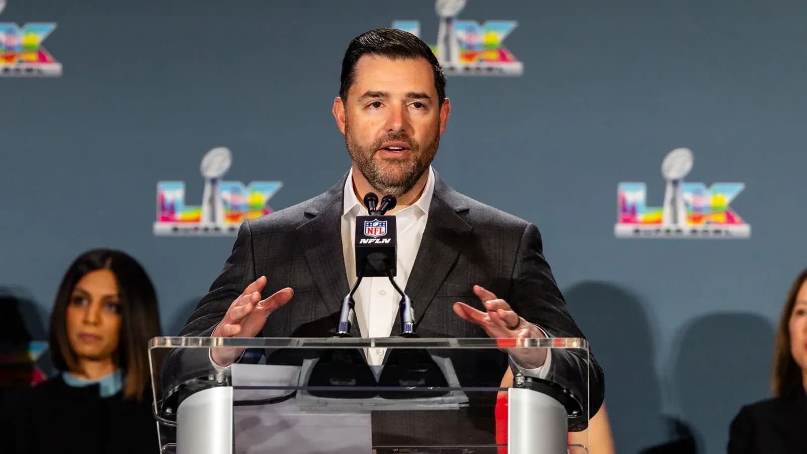 Speaker at NFL press conference addressing audience Speaker at NFL press conference addressing audience