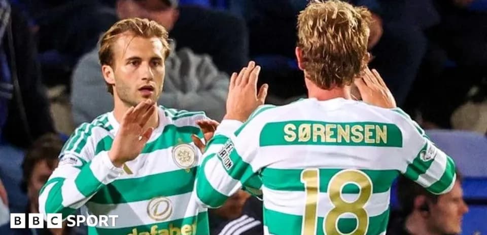 Celtic players celebrating on the pitch Celtic players celebrating on the pitch